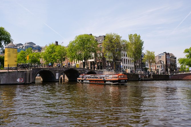 Amsterdam 1h Canal Cruise by Semi-Open Boat with Audio Guide - Gables, Narrow Facades, and the 16th–17th Century Merchant Story
