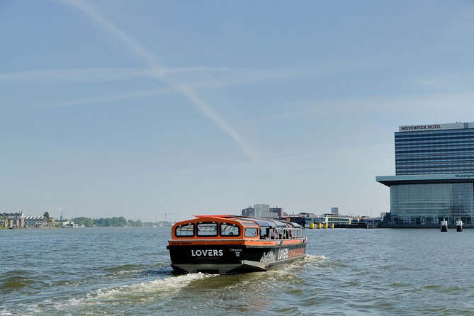 Amsterdam 1h Canal Cruise by Semi-Open Boat with Audio Guide - Munt Tower and the Medieval City-Wall Connection