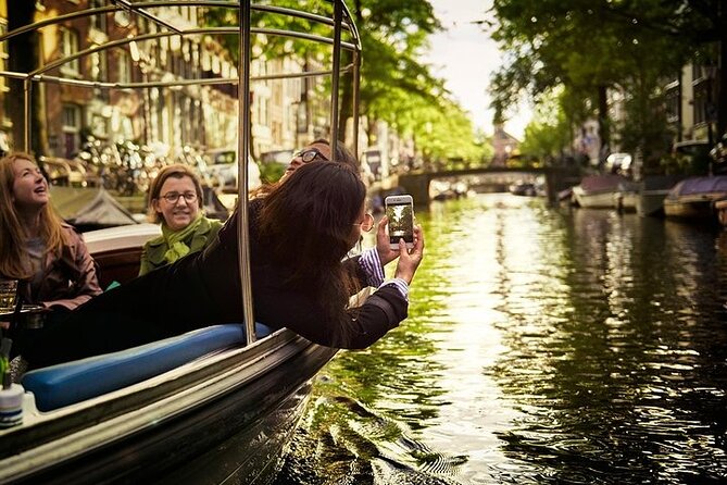 Amsterdam 2-hour Private Canal Cruise with Live Guide and Drinks - Jordaan canals: the quieter, more local Amsterdam side