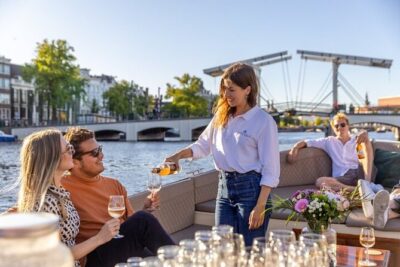 Amsterdam 2 Hour Small-Group Canal Cruise with Dutch Snacks & Bar - The live skipper voice: how to get more out of every canal pass