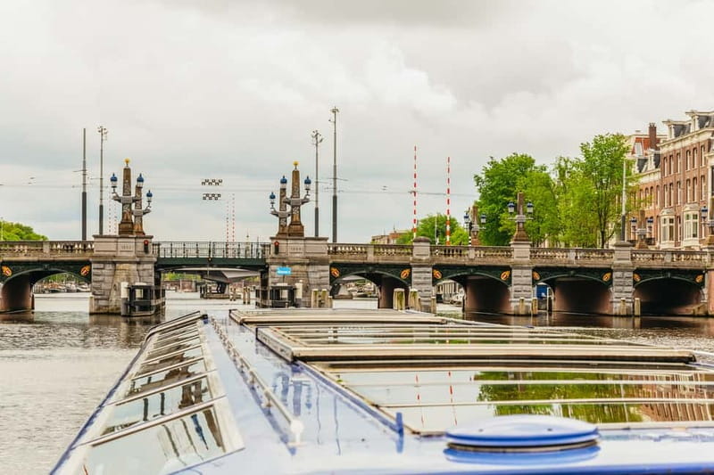 Amsterdam: 75 Minute City Canal Cruise with Audio Guide - Magere Brug and the museum quarter: classic postcard photos, no extra planning