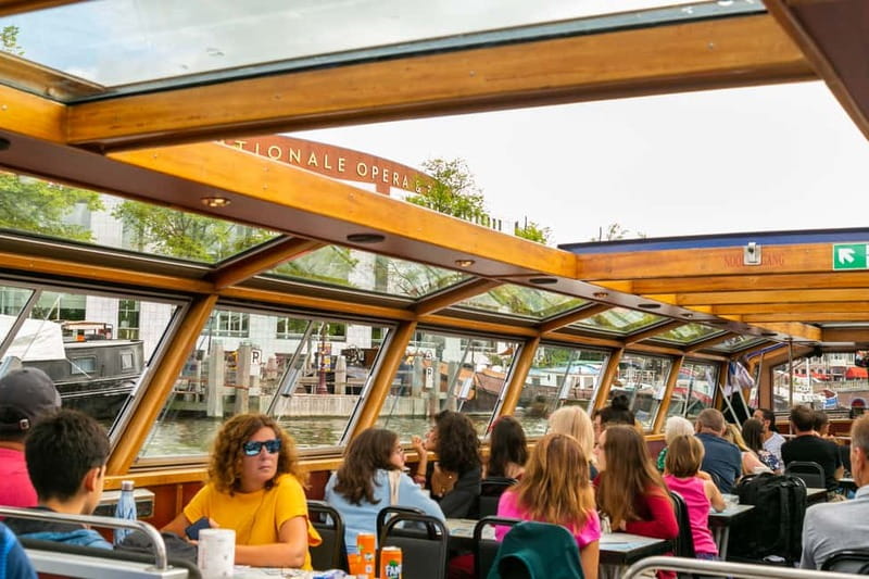 Amsterdam: 75 Minute City Canal Cruise with Audio Guide - Audio guide reality check: earphones, side cues, and kids entertainment
