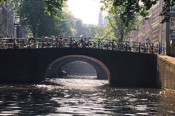 Amsterdam 90-min Private Canal Cruise with Live Guide and Drinks - Dancing Houses and the Monet-Era Canal You Can Still Recognize