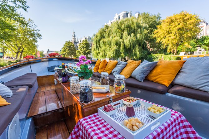Amsterdam All-Inclusive 90-Minutes Heated Cruise by Captain Jack - What the boat experience feels like: heated comfort, snacks, and the open-air catch