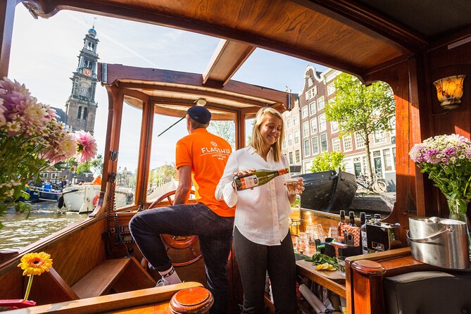 Amsterdam Canal Cruise in Classic Salon Boat With Drinks and Cheese - Inside the classic salon boat: step up, then relax