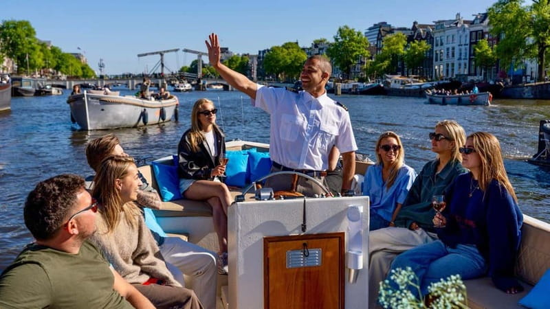 Amsterdam: Canal Cruise in Open Boat with Drink Option - Why this open electric canal cruise feels different than the usual Amsterdam ride