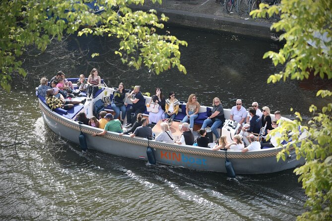 Amsterdam Canal Cruise in Open Boat with Unlimited Drinks Option - The ride rhythm: quick photo moments and real canal texture