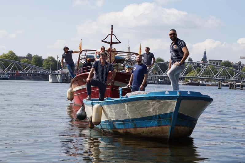 Amsterdam: Canal Cruise on a Wooden Refugee Boat - A Wooden Refugee Boat Turns Canal Time Into a Story You Can Feel
