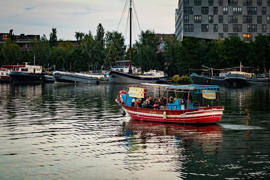 Amsterdam: Canal Cruise on a Wooden Refugee Boat - The 90-Minute Ride: Canals and the Amstel River