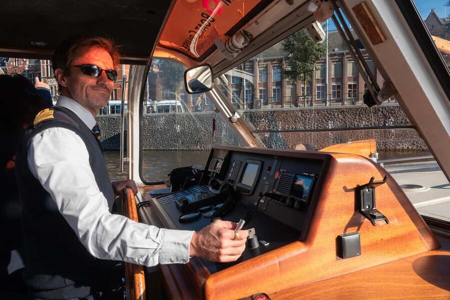 Amsterdam: Canal Cruise with Live Commentary & Audio Guide - Anne Frank House from the Water: Quick Photo Stop, Clear Expectations