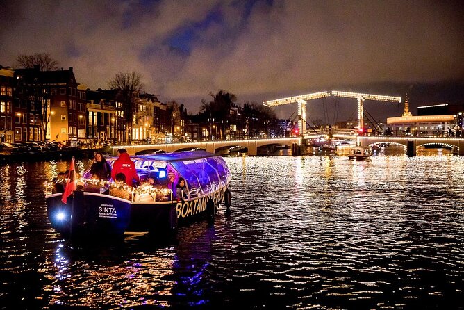 Amsterdam Canal Cruise With Live Guide and Unlimited Drinks - The first stretch: Hermitage area, the Amstel, and famous bridge moments