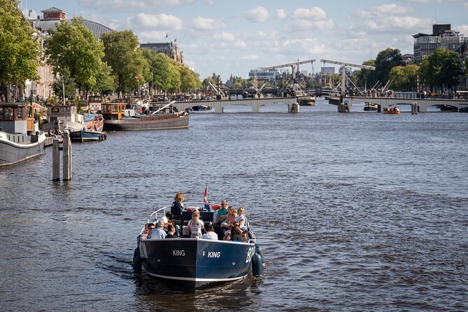 Amsterdam Canal Cruise with Live guide & Two drinks - Central St. - Restroom On Board and Comfort That Helps on a Rainy Day