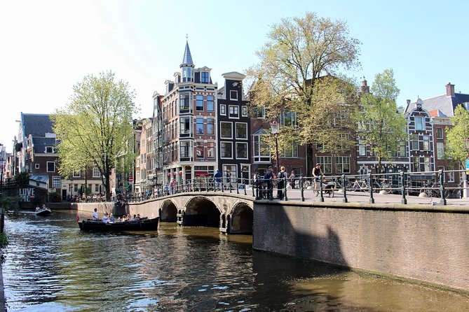 Amsterdam Canal Tour by Open Boat – 90 min Small Group Experience - Seven Bridges canal views and the Skinny Bridge finish