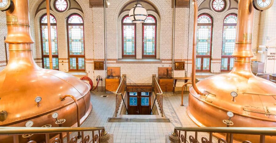 Amsterdam: City Canal Cruise and Heineken Experience Ticket - The 75-Minute Canal Cruise: UNESCO Views With 19 Languages in Your Ears