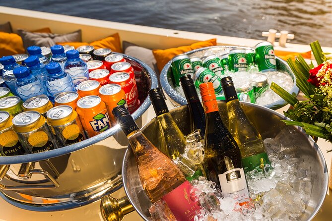 Amsterdam Classic Saloon Boat Canal Cruise with Live Guide - Cruising the Amstel River: relax while you learn your bearings