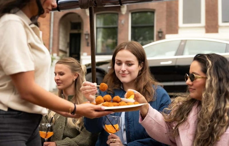 Amsterdam: Covered Heated Canal Cruise with Bitterballen - Weather-Proof Comfort: Covered Roof, Heather, and Open Windows