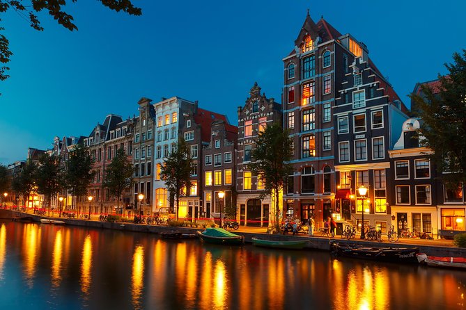 Amsterdam Evening Canal Cruise with Live Guide and Onboard Bar - The Amstel, Munttoren, and the City’s Origins You Can See