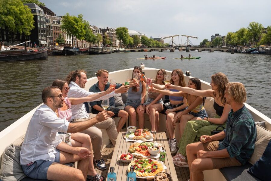 Amsterdam: German Guided Canal Cruise with on Board Bar - Entering Amsterdam via the Starboard Dock Canal Loop