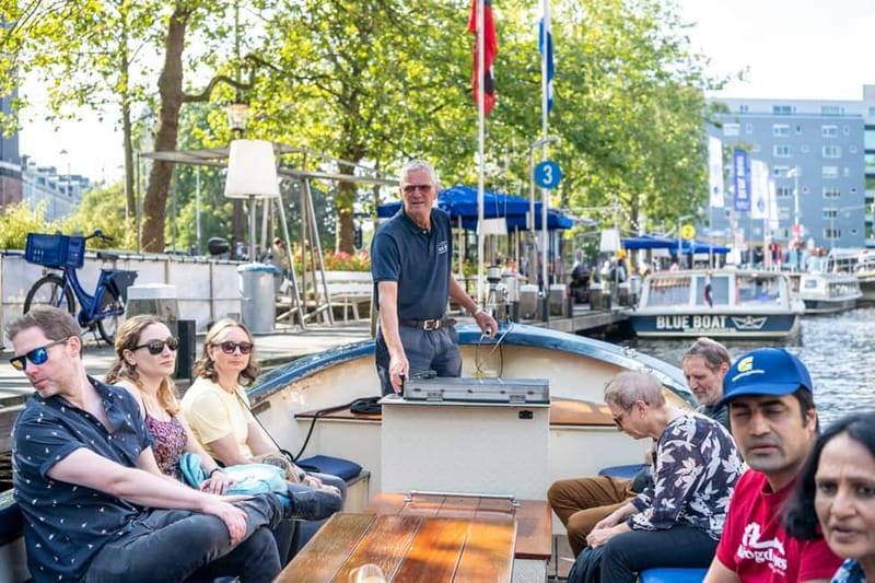 Amsterdam: Guided City Highlights Open Boat Canal Cruise - Why the open boat changes how you see Amsterdam canals