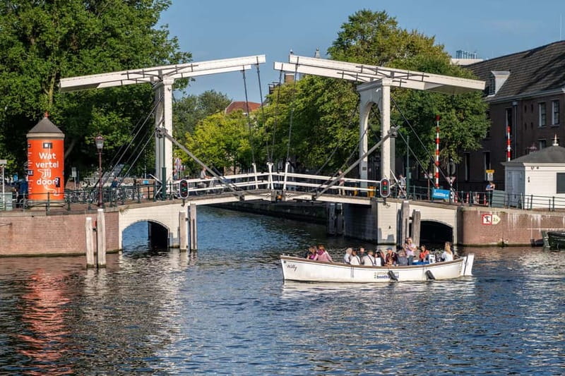 Amsterdam: Guided City Highlights Open Boat Canal Cruise - Photo stops and canal views: how to get better shots from an open boat