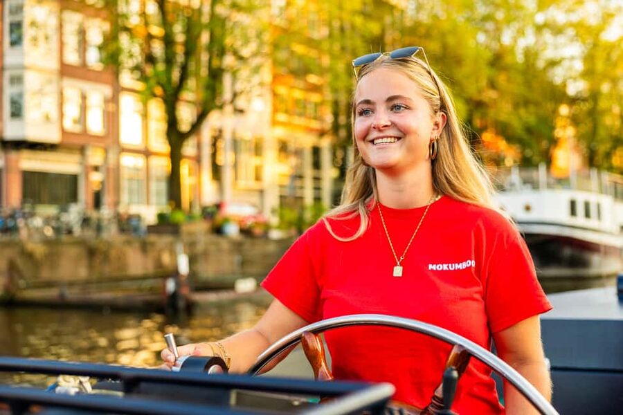 Amsterdam: Guided Open Boat Canal Cruise Including Drink - One hour of photo stops: how to get the most from the route