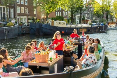 Amsterdam: Guided Open Boat Canal Cruise Unlimited Drinks Option - The 60-Minute Route: Cuypers, Defense Towers, NEMO, and Maritime Stories
