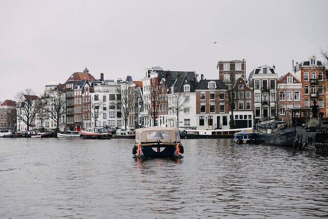Amsterdam Newest Canal Cruise with local guide and small group - Passing Saint Nicholas Basilicas and Maritime Stories