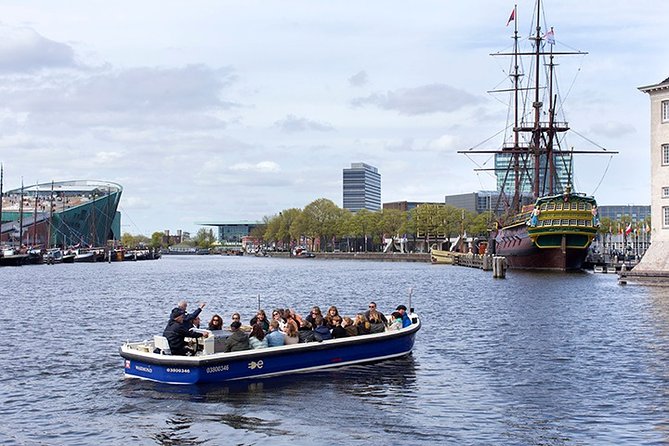 Amsterdam Open Boat Sightseeing Canal Cruise - The Amstel Hotel and the Riverbank Story You Can See Quickly