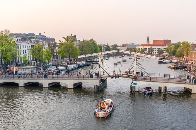 Amsterdam: Saloon Boat Cruise + Unlimited Drinks & Bite option - Weather tips: how to stay comfortable in Amsterdam wind and rain