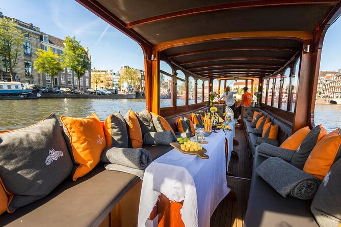 Amsterdam Small-Group Bike Tour With Canal Cruise, Drinks, Cheese - Prins Hendrik Bust and the Canal Cruise Finish