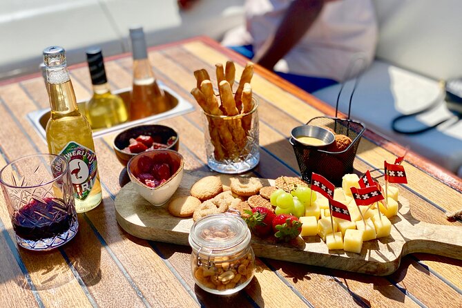 Amsterdam Small-Group Canal Cruise Including Snacks and Drinks - Timing and weather: plan for comfort on a 2-hour cruise