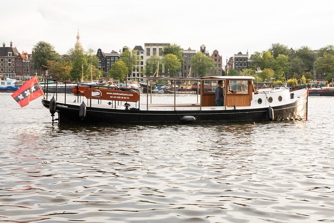 Amsterdam Small-Group Canal Cruise With Dutch Snacks and Drink - Why a small electric boat beats the big-boat canal crush
