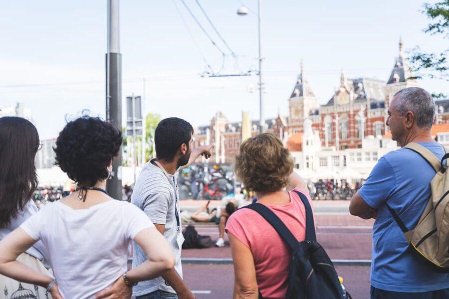 Amsterdam Small-Group Walking Tour with Canal Cruise - Dam Square to Royal Palace: big icons, human stories