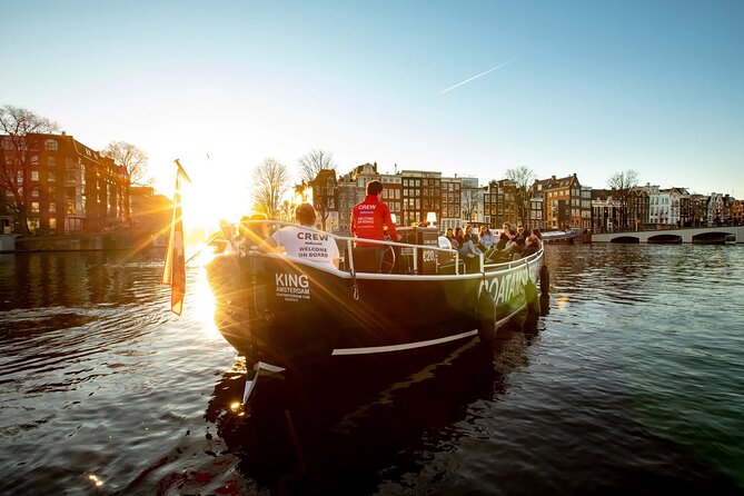 Amsterdam Sunset Canal Cruise with Live Guide and Open Bar - Getting Oriented: Meet at Amstel 51F and Start by the Hermitage