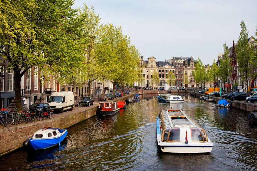 Amsterdam Walking Tour and Canal Cruise - Why this Amsterdam combo works: walk, market, then float the UNESCO canals
