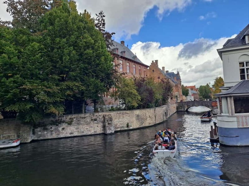 Day trip to Bruges from Paris with canal cruise - Walking the medieval core with a guide who helps you see details fast