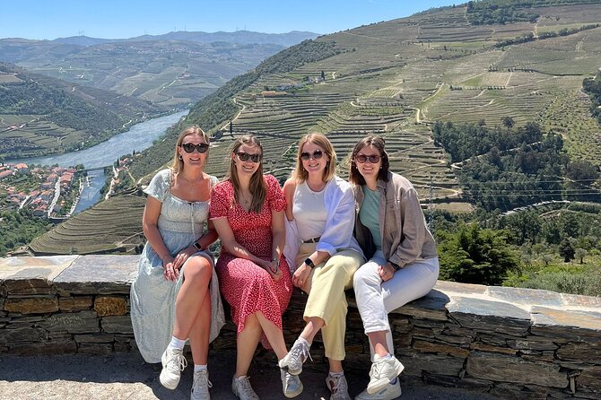 Douro Valley Tour - 3 Wine tastings, Lunch & river Cruise - Peso da Régua: coffee, river views, and that 19th-century bridge walk