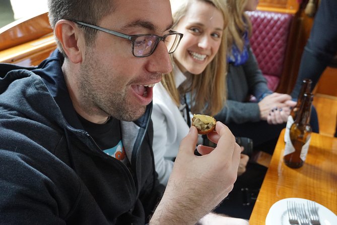 Eating Amsterdam: Food Tour & Canals Cruise - Jordaan walking: canals, 17th-century views, and food-story context