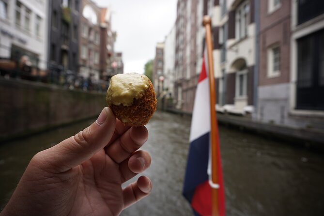 Eating Amsterdam: Food Tour & Canals Cruise - Vishandel Centrum: herring and kibbeling in a real fishmonger setting
