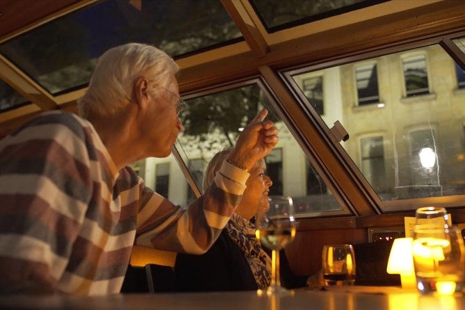 Evening Canal Cruise in Amsterdam with Wine & Cheese Option - Audio commentary reality check: recorded narration beats live “street theater”
