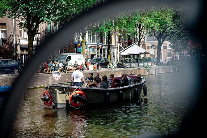 Guided Amsterdam Canal Cruise – Snacks & Drinks on board(1 Hour) - Hidden green calm and the remnants of an old city wall