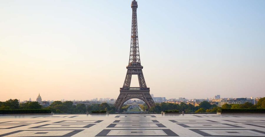 Paris: Eiffel Tower Summit Access Tour and River Cruise - The short host-led walk that sets up the Eiffel Tower