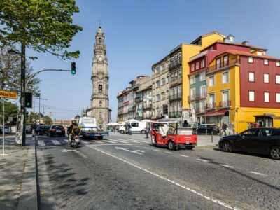 Porto: Guided Tour by Tuk-Tuk & Optional Douro River Cruise - The historic center highlights: São Bento, Porto Cathedral area, and Clerigos Tower passes