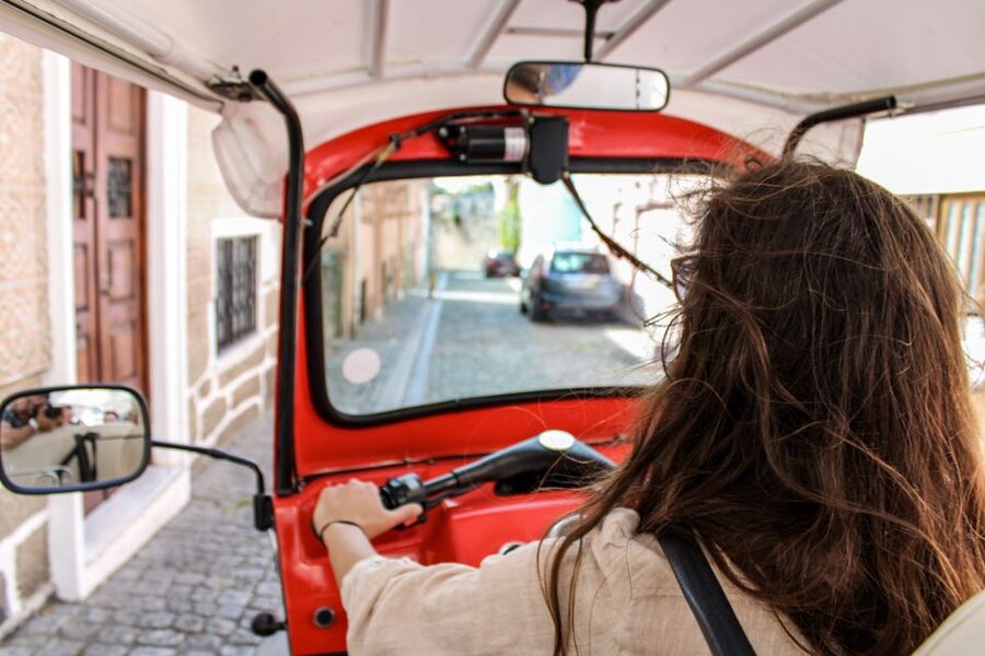 Porto: Guided Tour by Tuk-Tuk & Optional Douro River Cruise - Stock Market Palace and Miragaia: the walkable path toward the river
