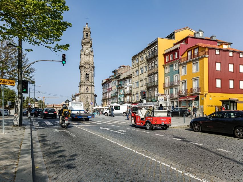 Porto: Guided Tour by Tuk-Tuk & Optional Douro River Cruise - The historic center highlights: São Bento, Porto Cathedral area, and Clerigos Tower passes