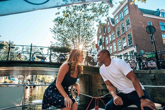 Private Romantic Canal Cruise Amsterdam with Bubbly and Snacks - The boat setup: heated seats, blankets, and weather cover that really helps