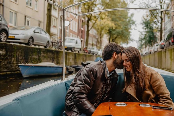 Private Romantic Canal Cruise Amsterdam with Bubbly and Snacks - Your guide: gentle history that doesn’t spoil the romance
