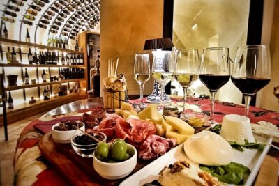 Rome Tiber River Ride and Top Food Tasting with Wine Pairing - Fabullus Wine Cellar: food, wine, and an ancient cistern vibe