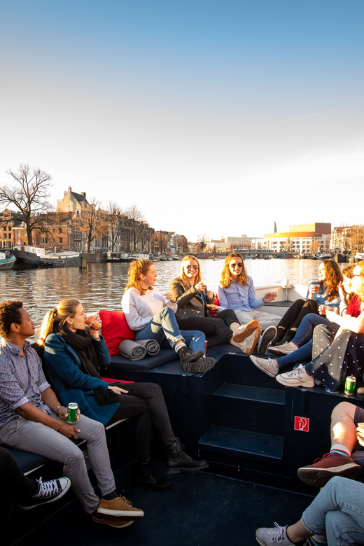 Small-Group Walking Tour with Amsterdam Canal Cruise - From streets to water: the 1-hour canal cruise (and the seven bridges wow factor)